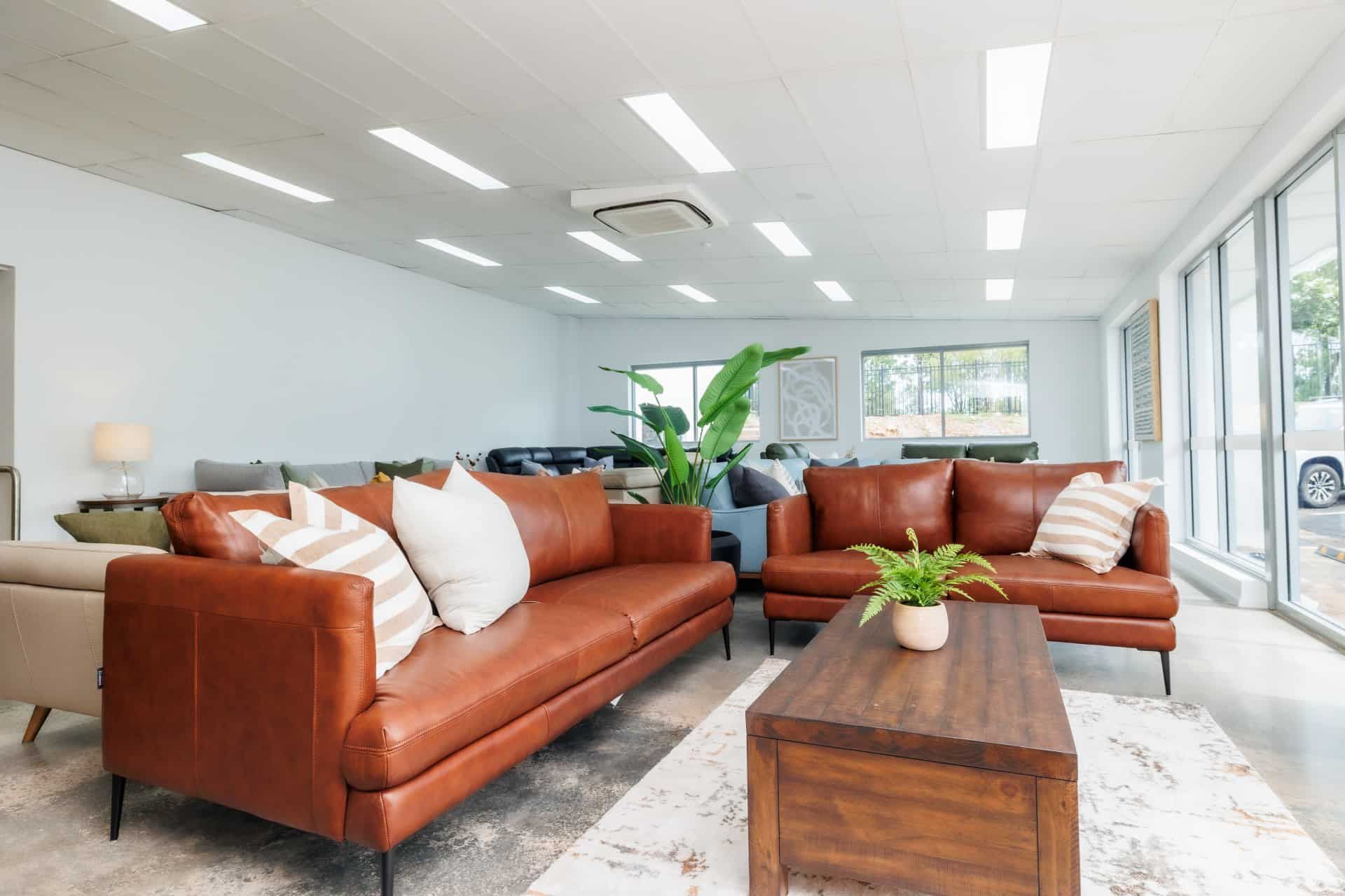 A Living Room Filled With Furniture and a Coffee Table — The Comfort Zone Darwin In Winnellie, NT