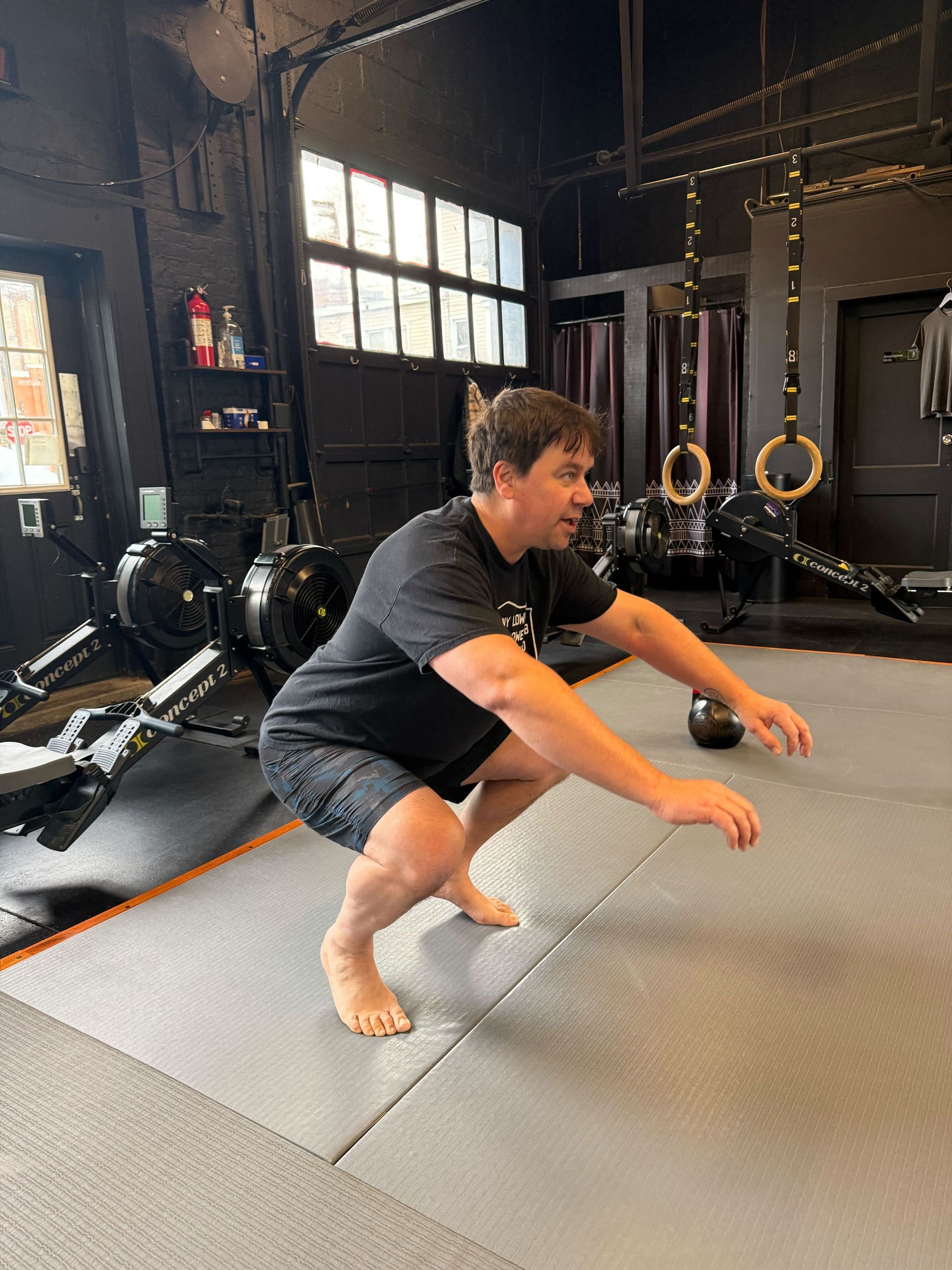 Coach guiding a small group through strength and mobility work at Soma MVMT in Maplewood, NJ for better movement.