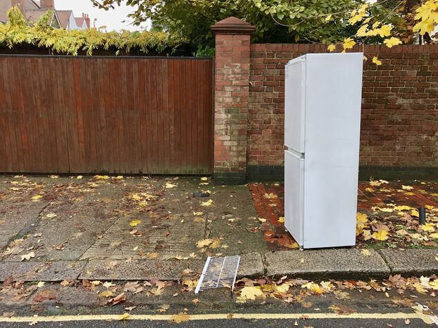 fridge on the sidewalk