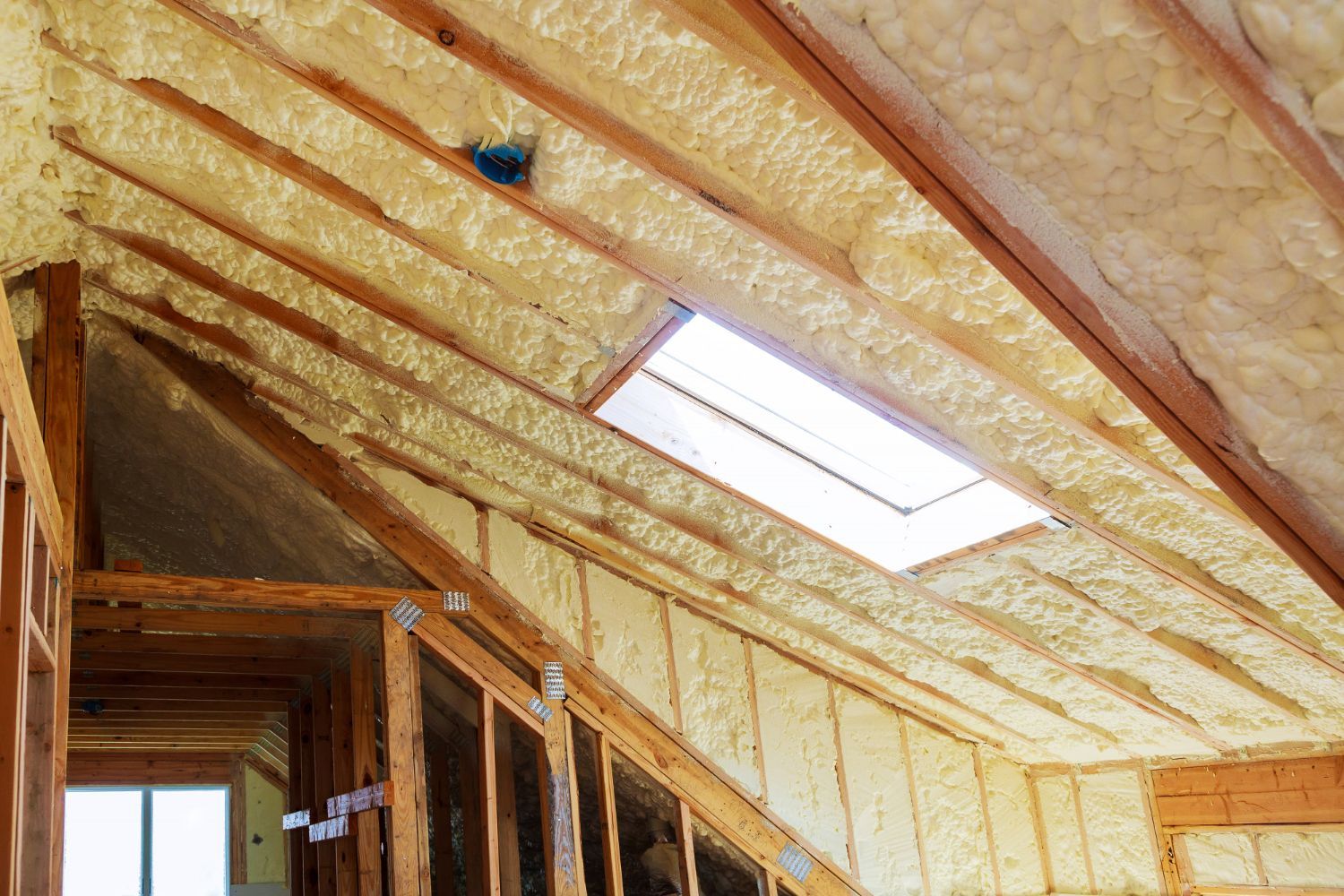 There is a skylight in the attic of a house.