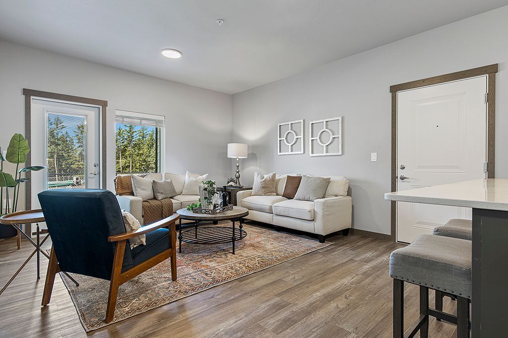 Photo showing a living room with plenty of space, as well as lots of natural lighting