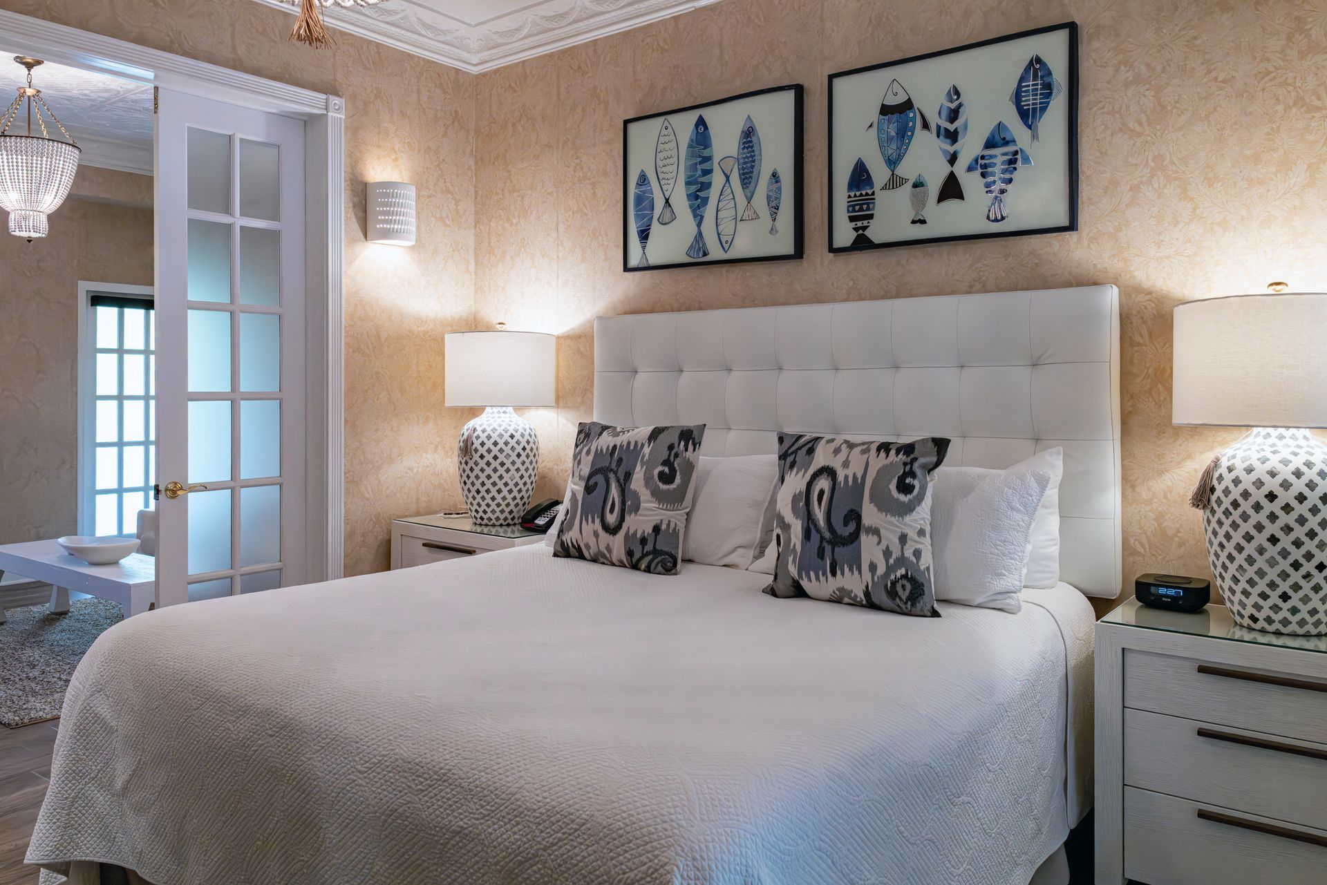 A bedroom with a king size bed and two nightstands