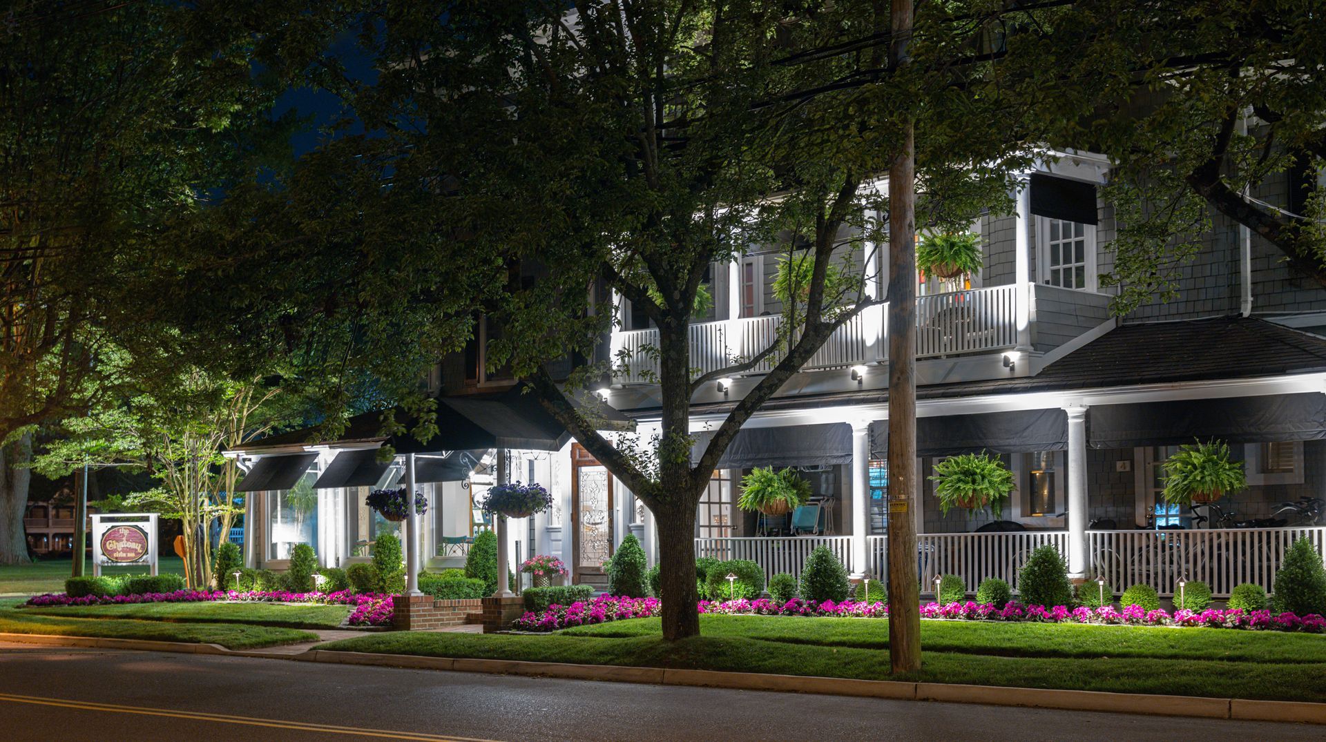 A row of houses are lit up at night.