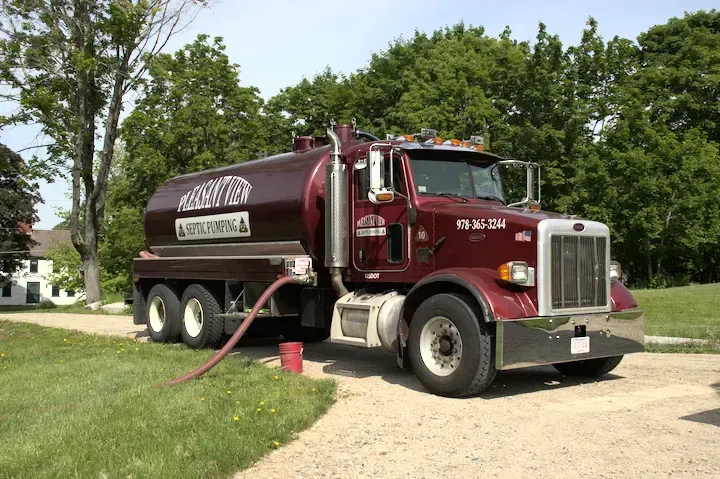 A sewage tank truck. A sewage tank truck.