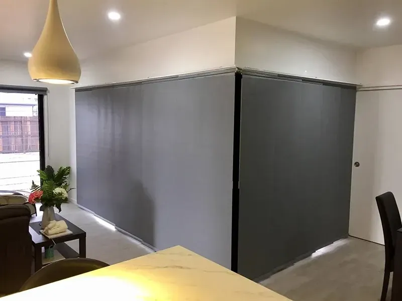A Living Room With A Dining Table And Chairs And A Gray Wall — Affordable Screens & Blinds in Thabeban, QLD