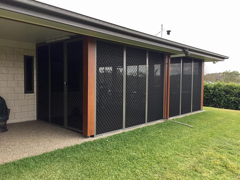 A House With A Screened In Porch And A Lawn In Front Of It — Affordable Screens & Blinds in Thabeban, QLD