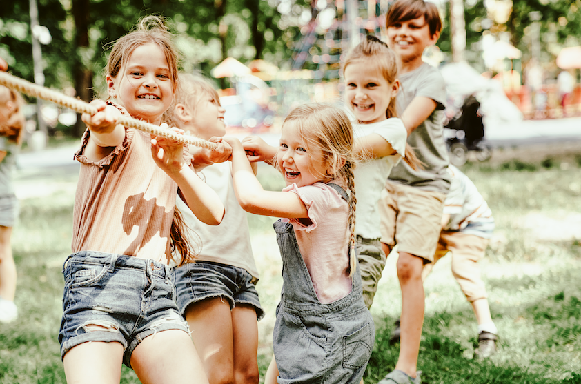 Kids playing tug of war.