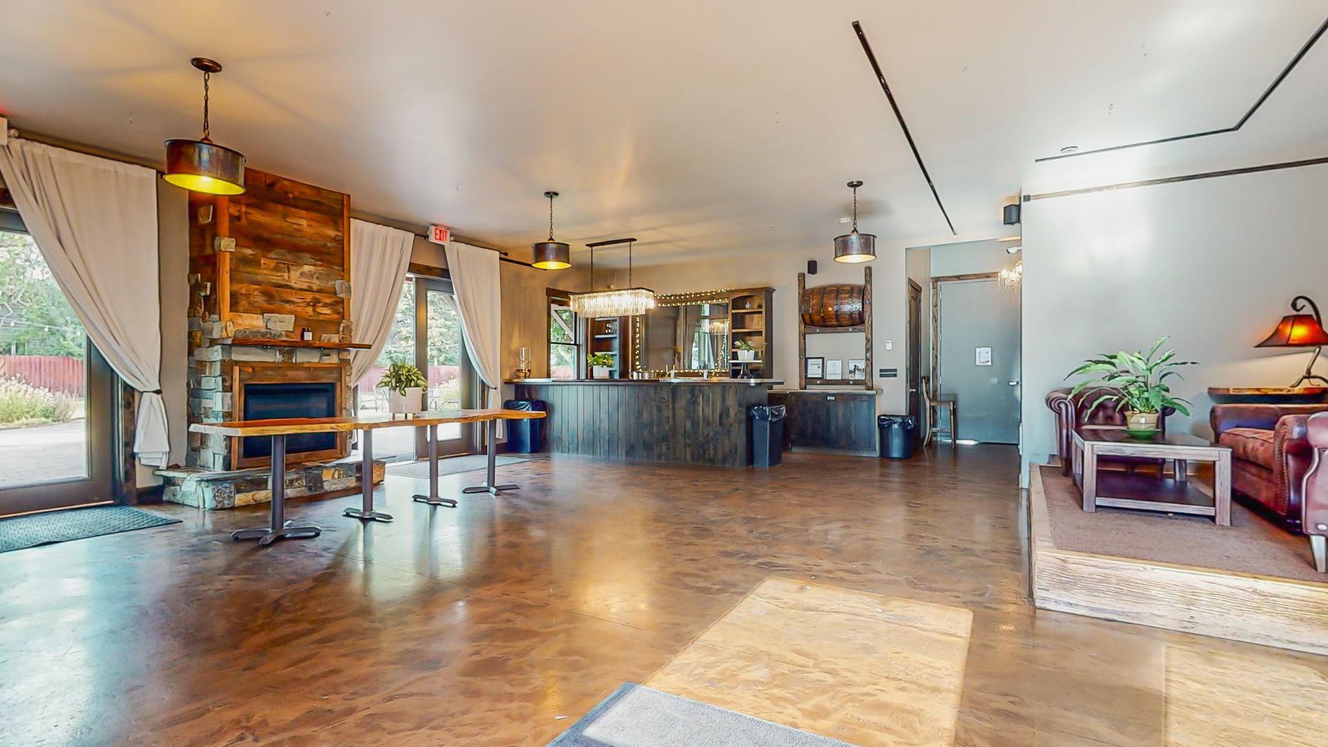 A large room with a lot of furniture and tables in it.