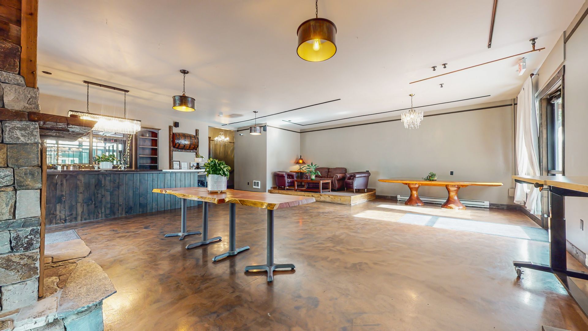 A large room with tables and chairs in it.