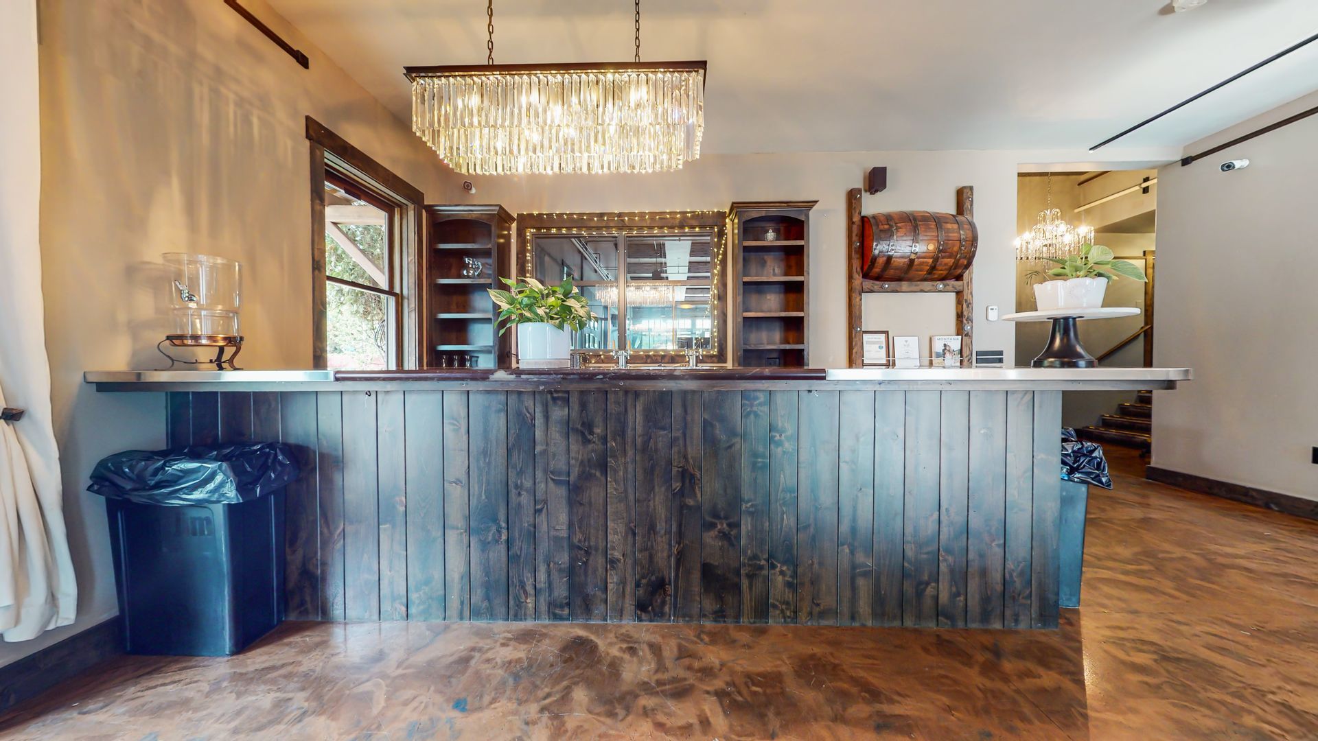 There is a large wooden counter in the middle of the room.