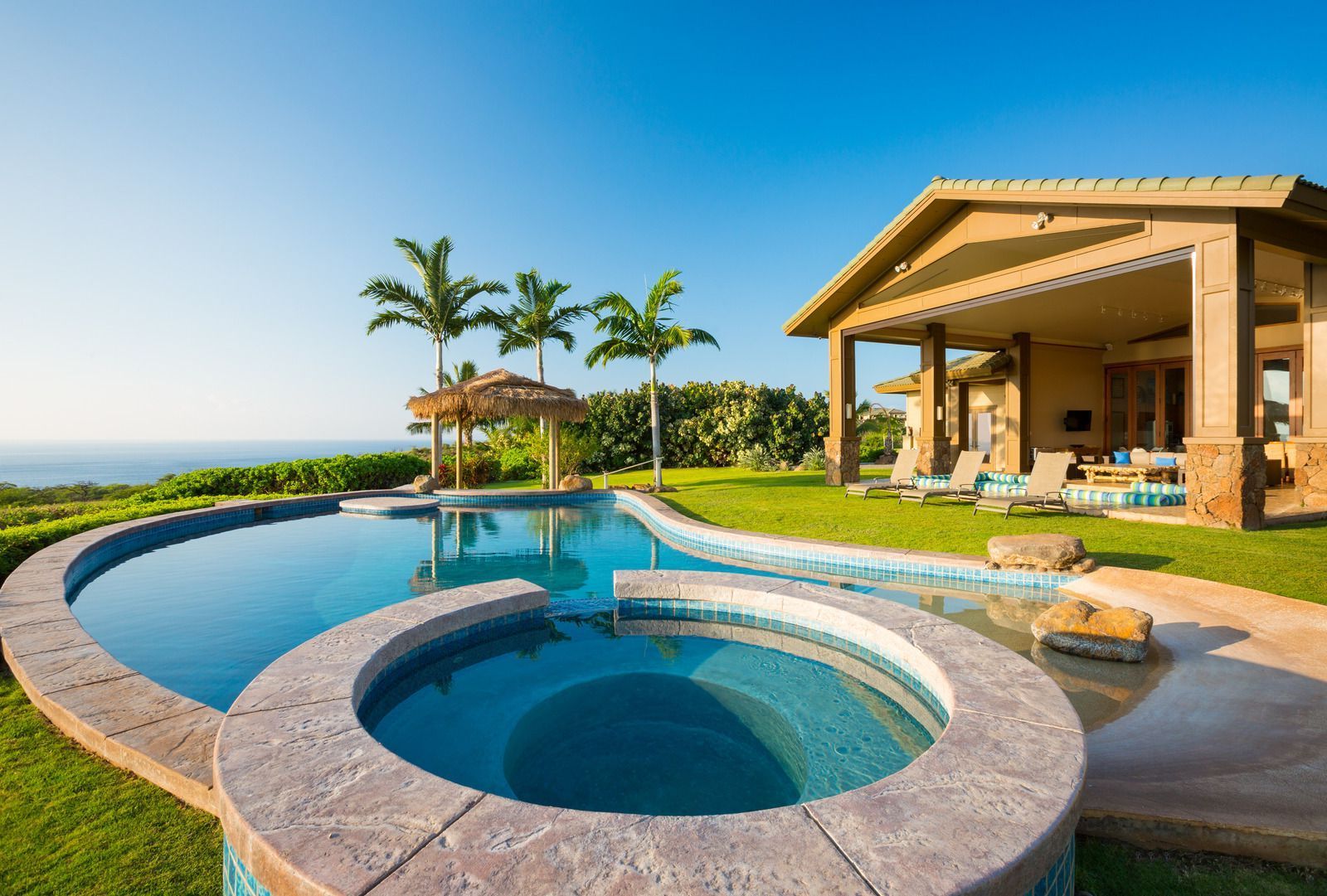 A large swimming pool with a screen around it