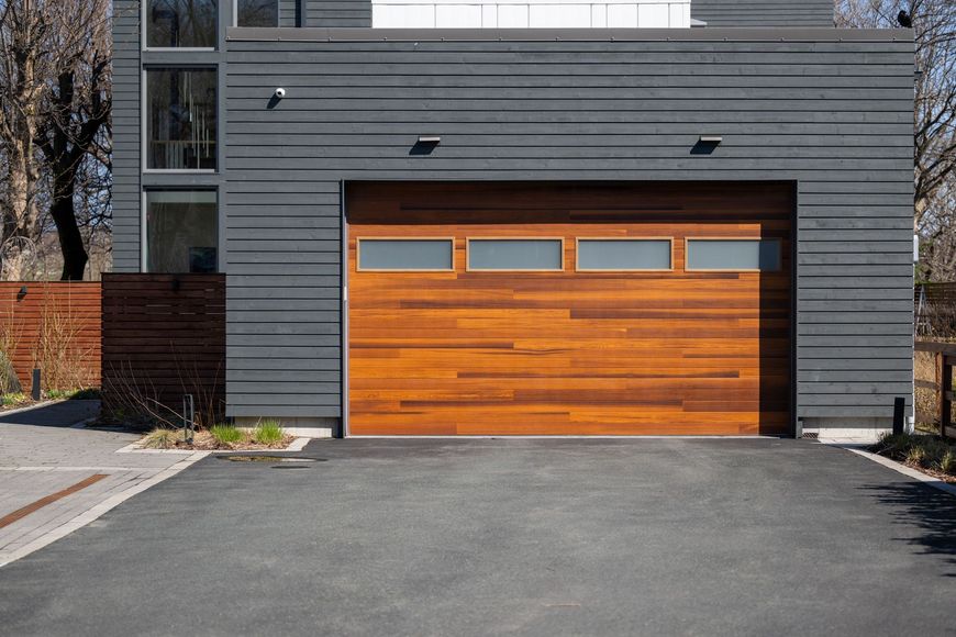 A modern house with a wooden garage door