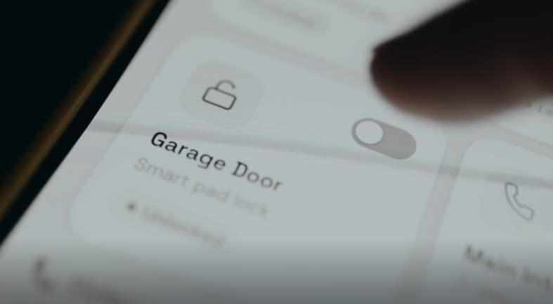 Person locks the Garage Door using a smart home security application on mobile phone