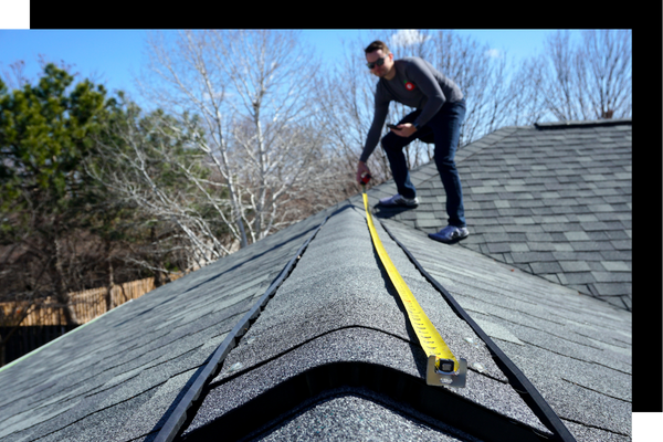 roofer measuring roof