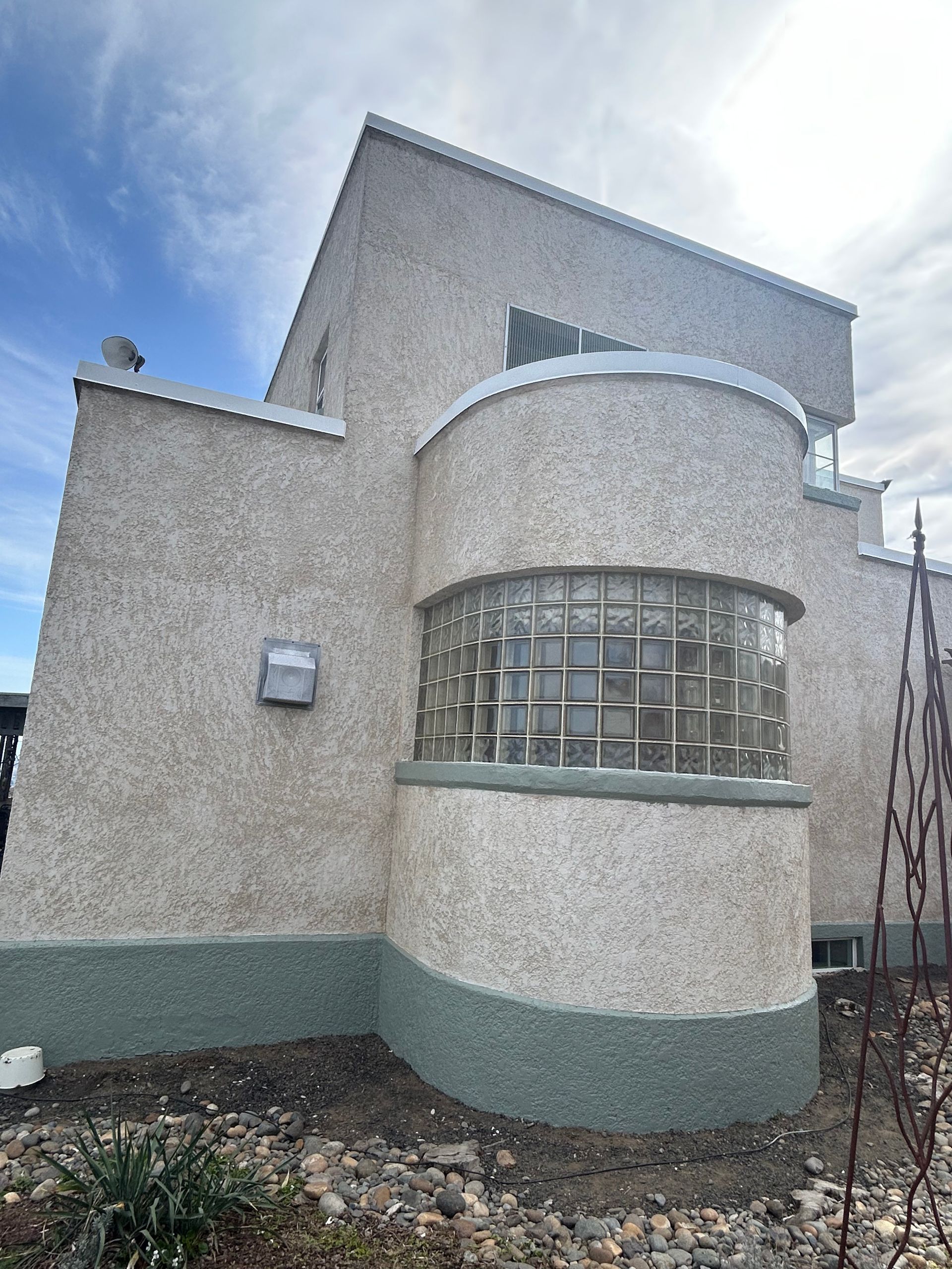A large building with a round window on the side of it.
