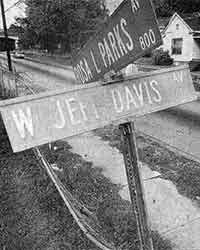 Street signs reading "Will Parks" and "W. J. F. Davis" at a residential intersection.