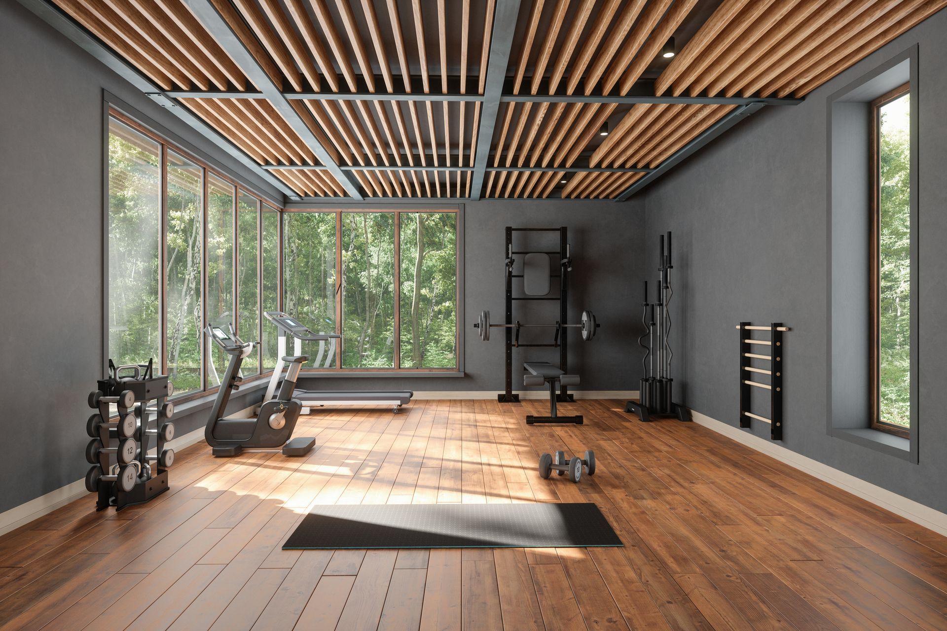 A gym with a treadmill , dumbbells , and a yoga mat.