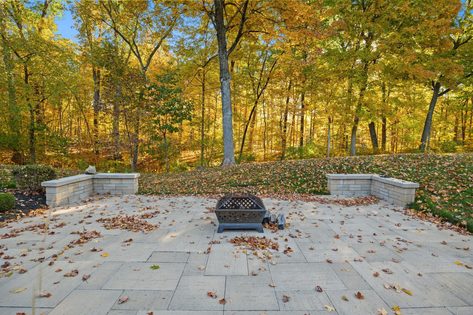 A staircase in a living room with a couch and a door.