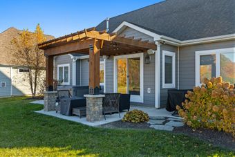 A staircase with a carpeted staircase and a wooden railing
