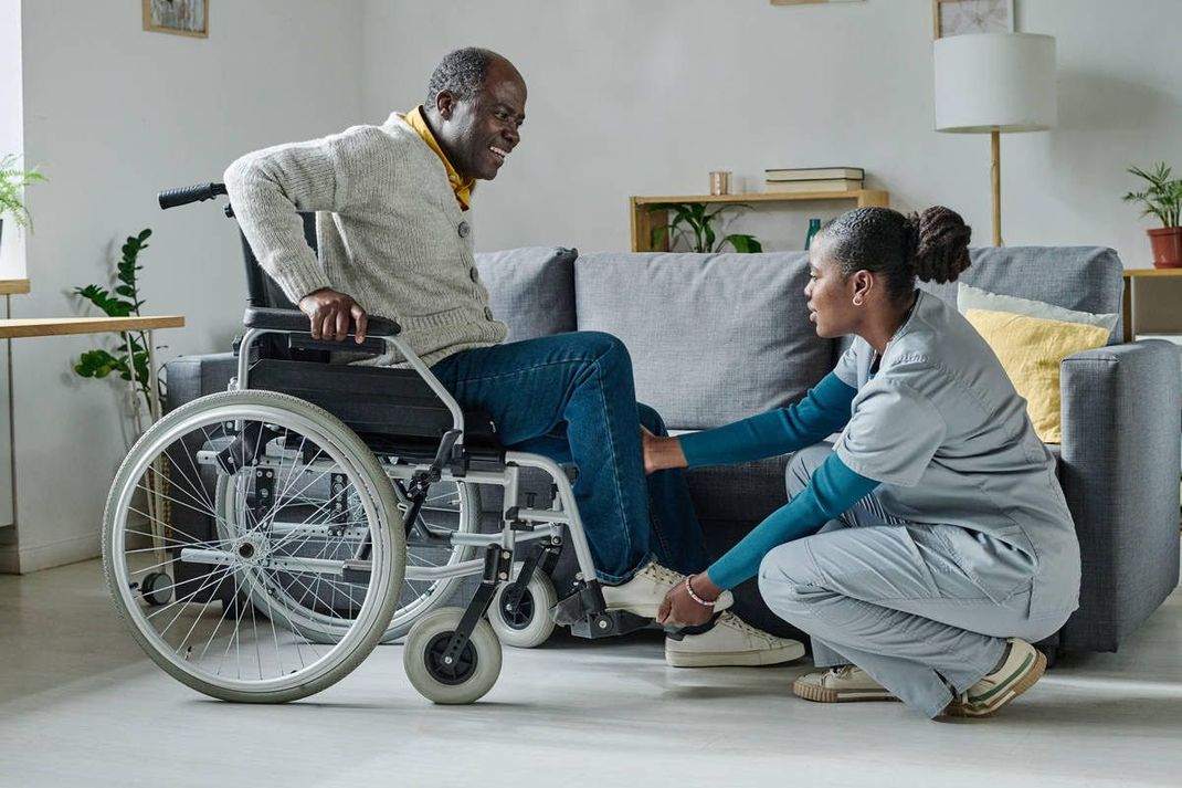 Nurse assisting a patient.