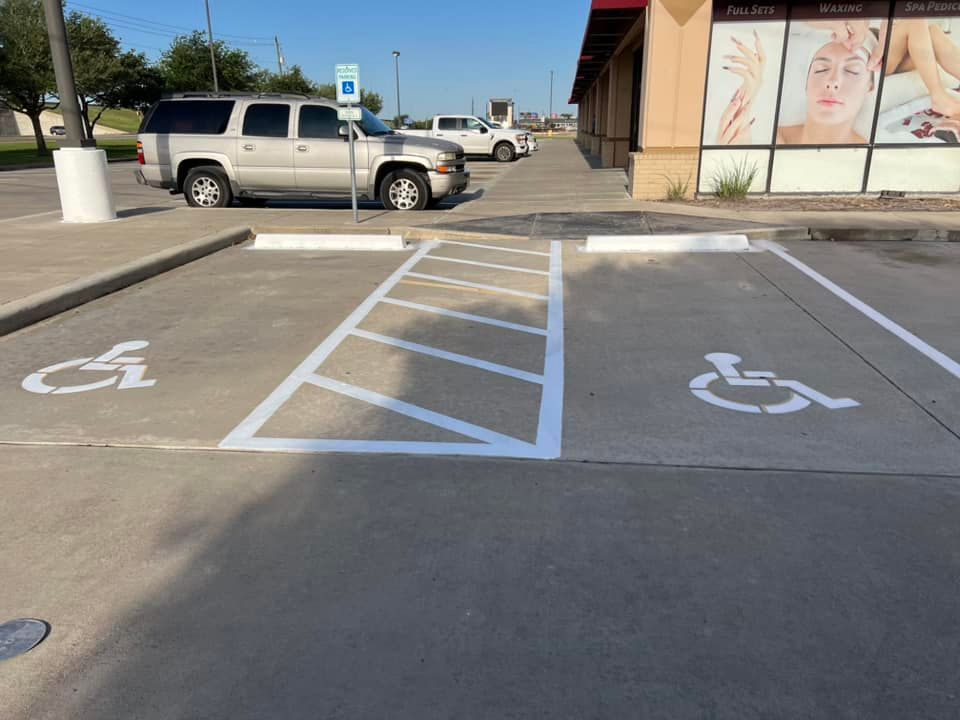 A handicapped parking spot in a parking lot