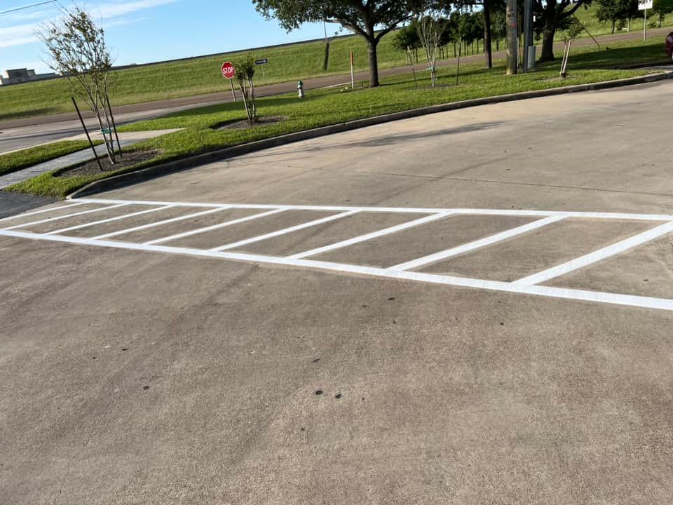 A parking lot with a stop sign in the background