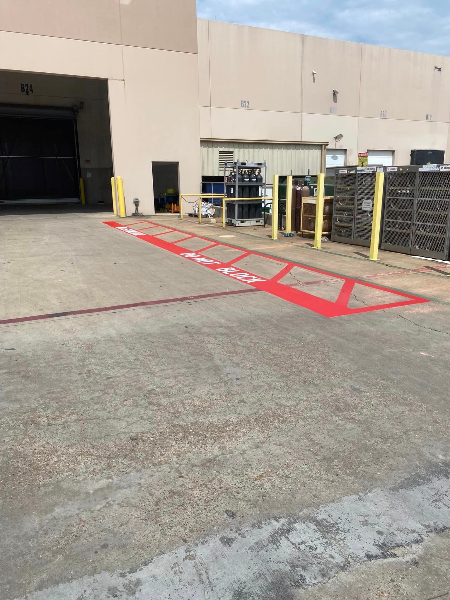 A parking lot with a red arrow painted on it