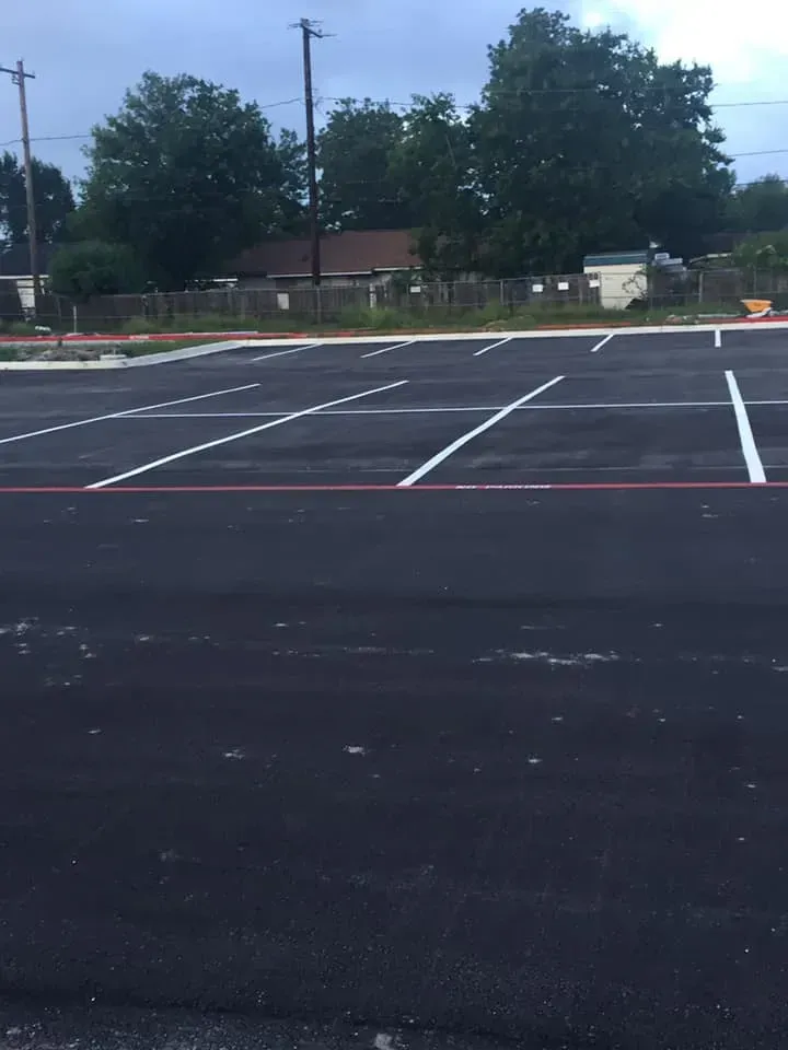 An empty parking lot with white lines on it