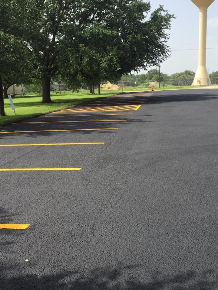 A parking lot with a water tower in the background
