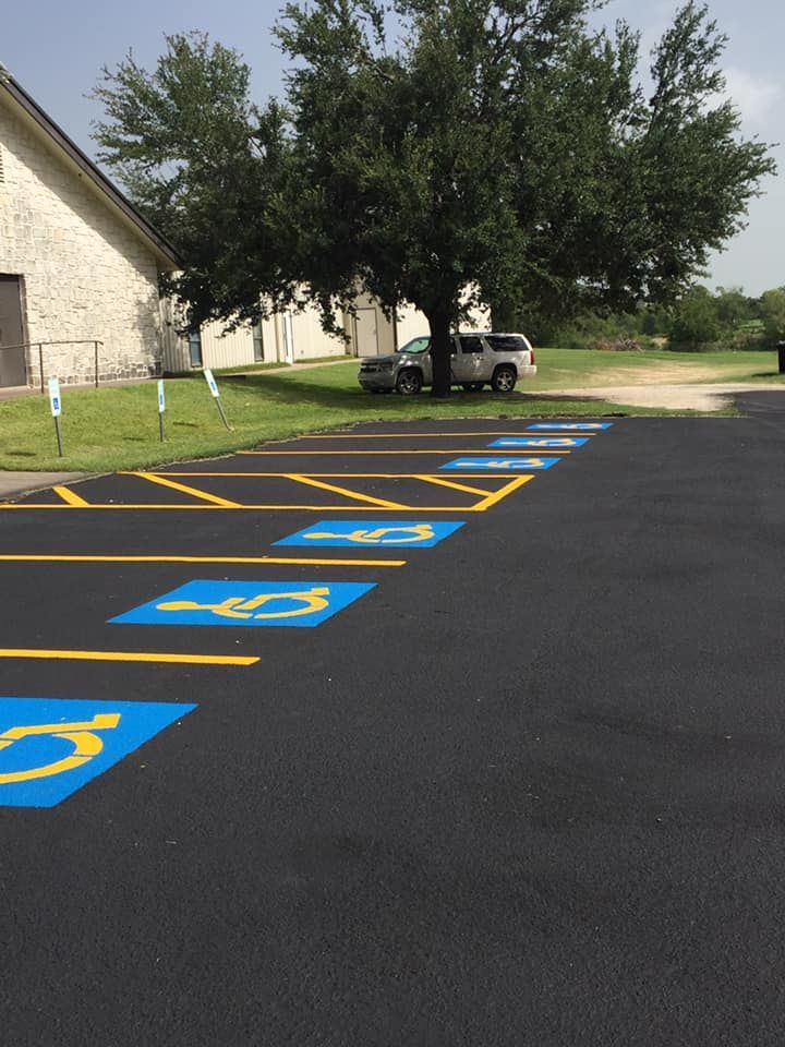 A parking lot with handicap signs painted on it