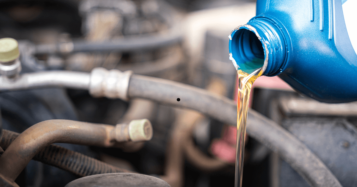 oil being poured into a vehicle during an oil change