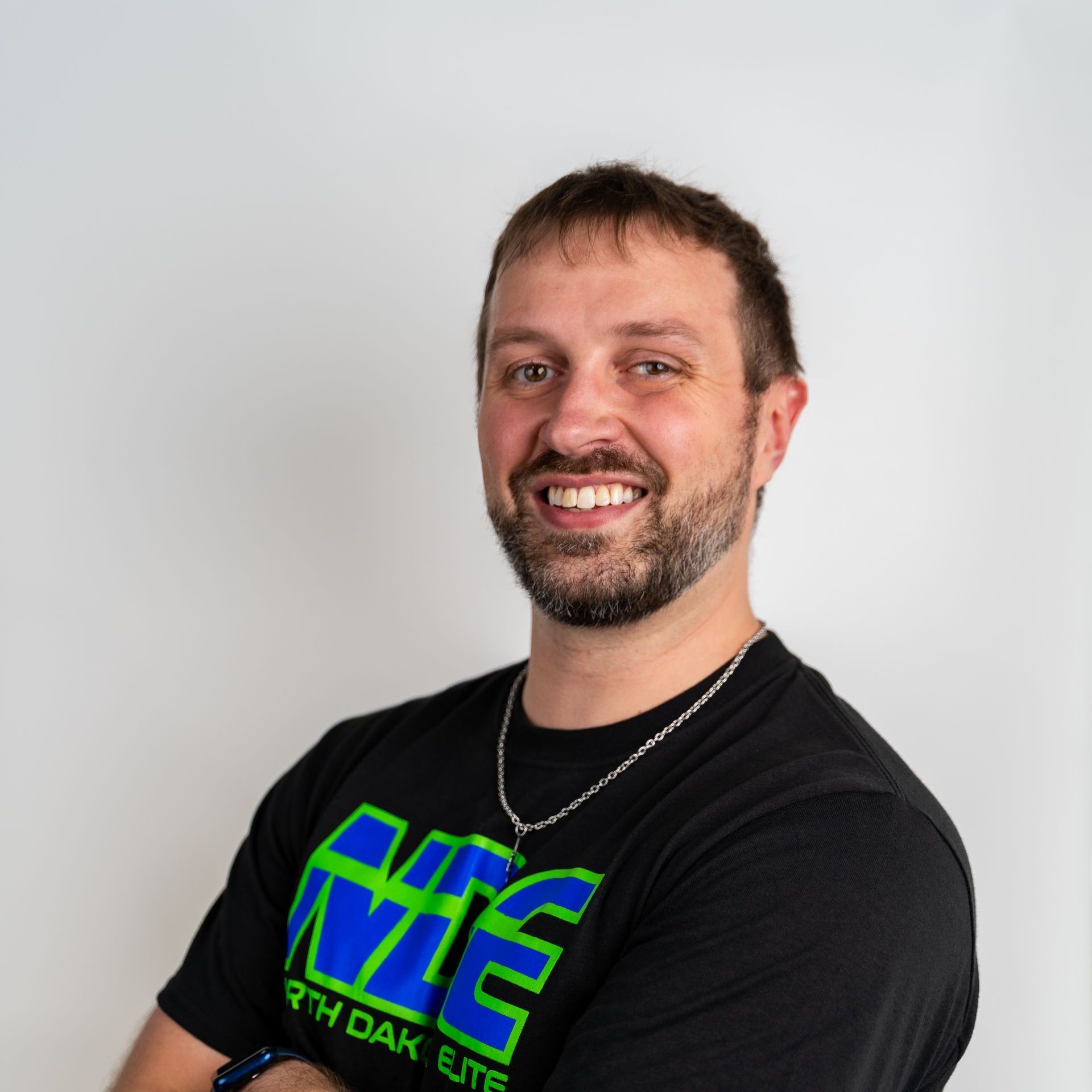 A man wearing a black t-shirt that says ufc on it