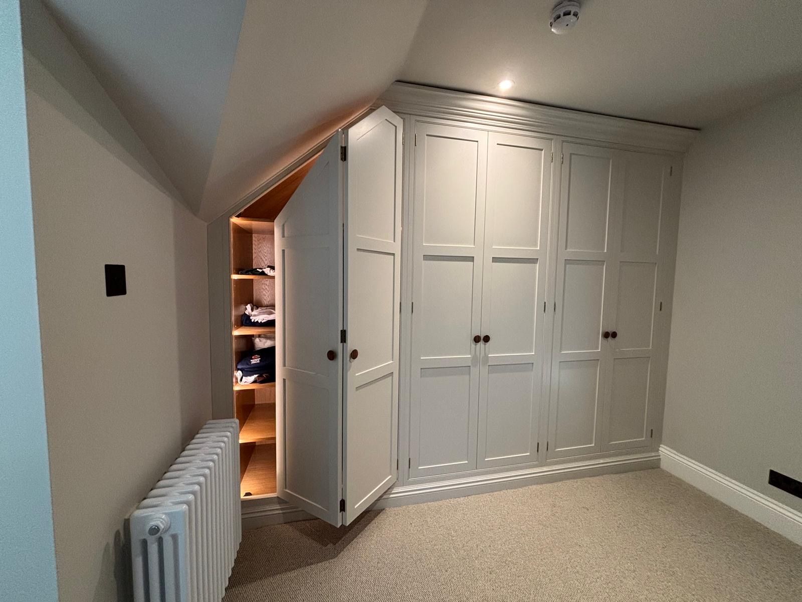 There is a radiator in the corner of the room.