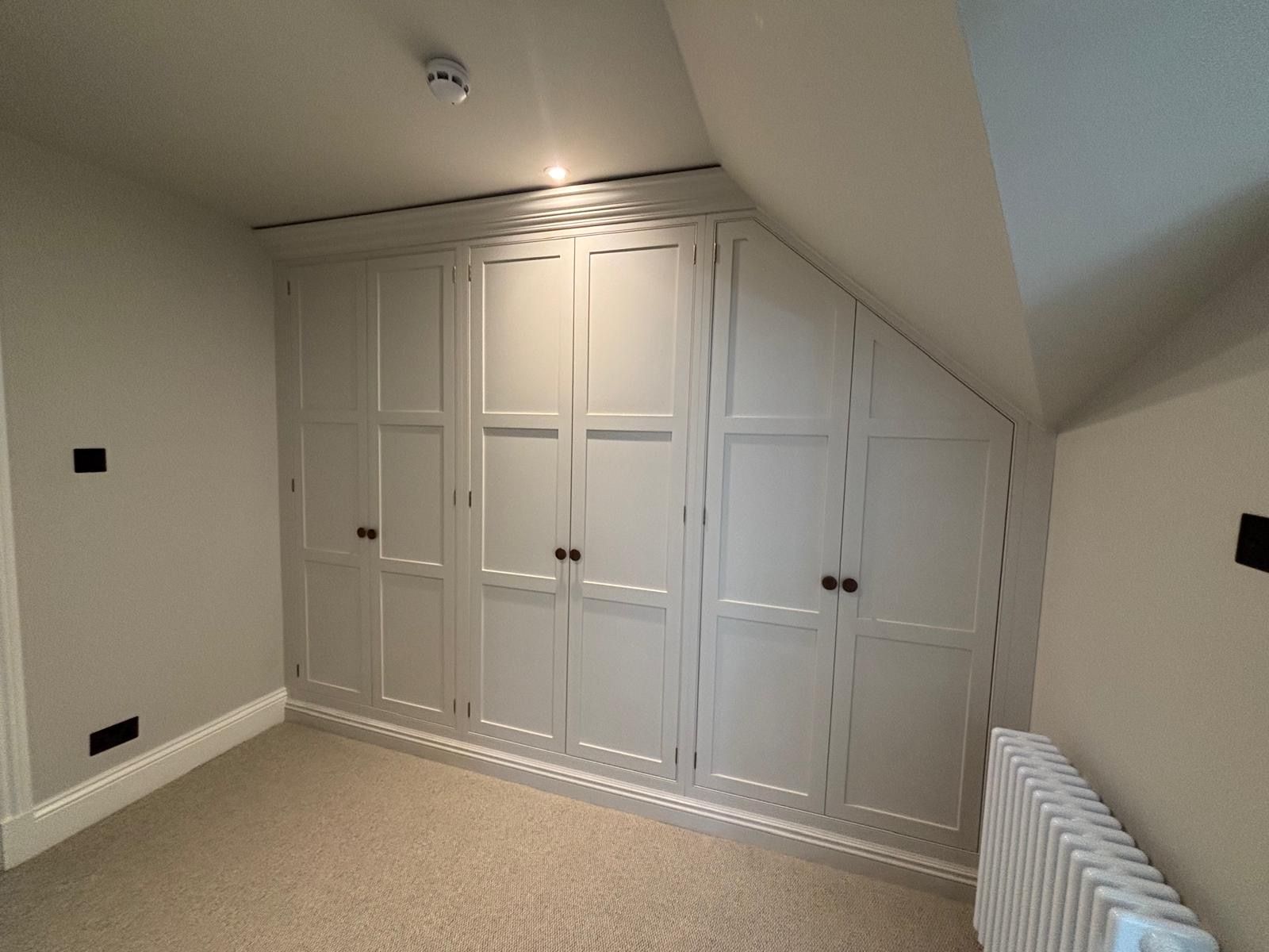 There is a radiator in the corner of the room.