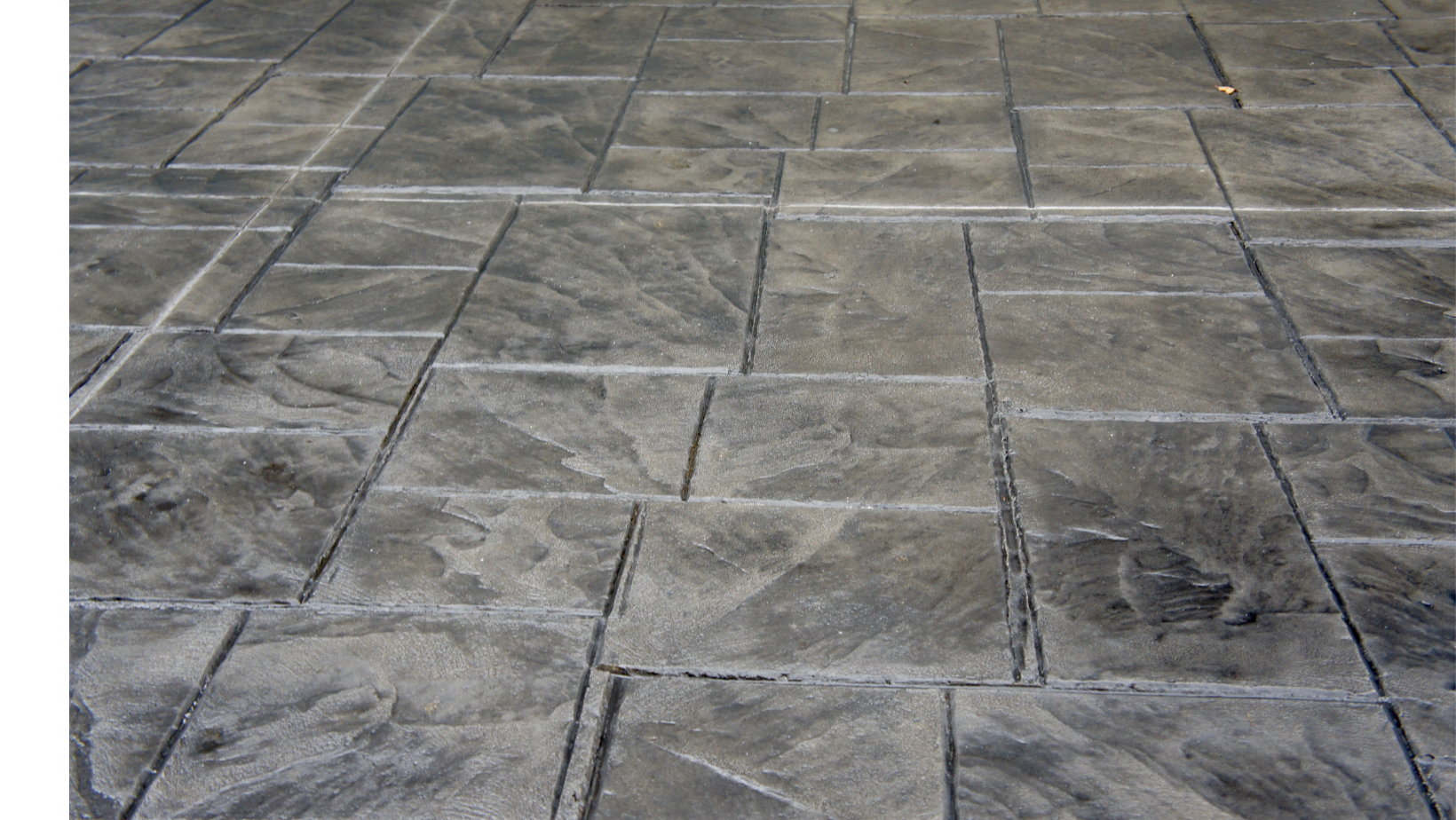 A close up of a gray tile floor