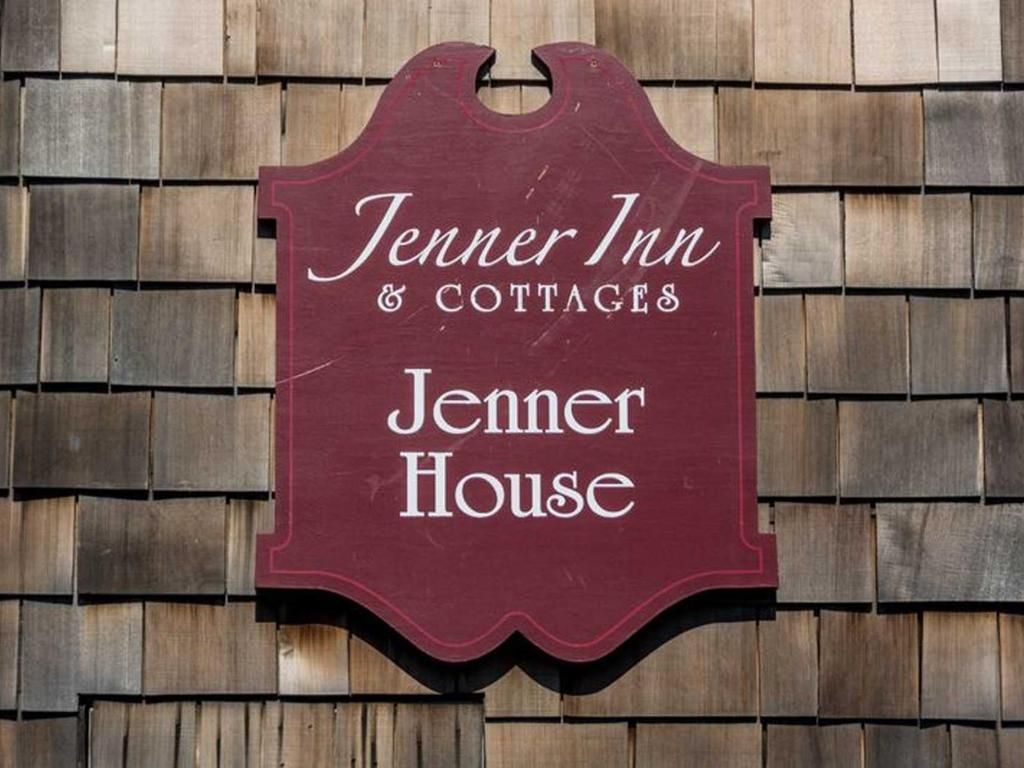 Jenner Inn & Cottages sign on wooden shingles, burgundy lettering, Jenner House.