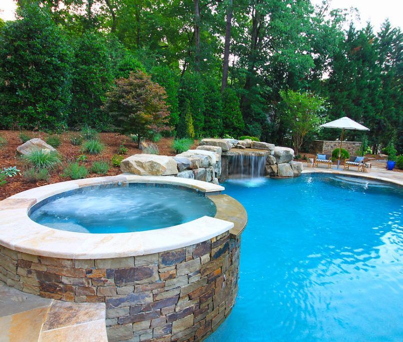 Backyard pool with hot tub