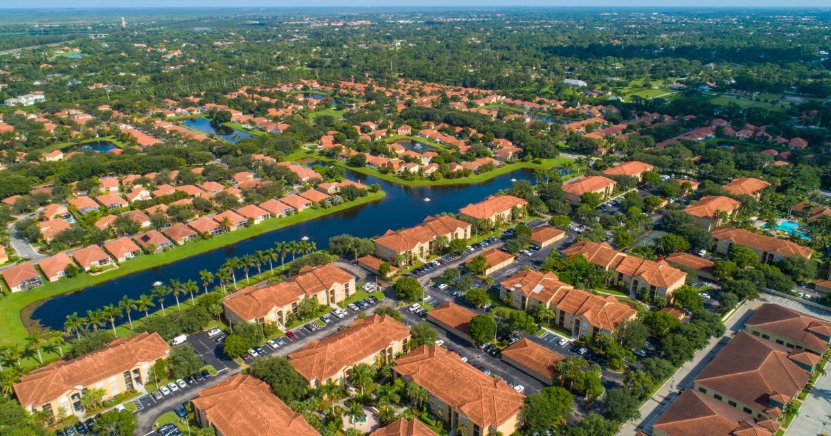 A living room with a lot of windows and a view of the desert.