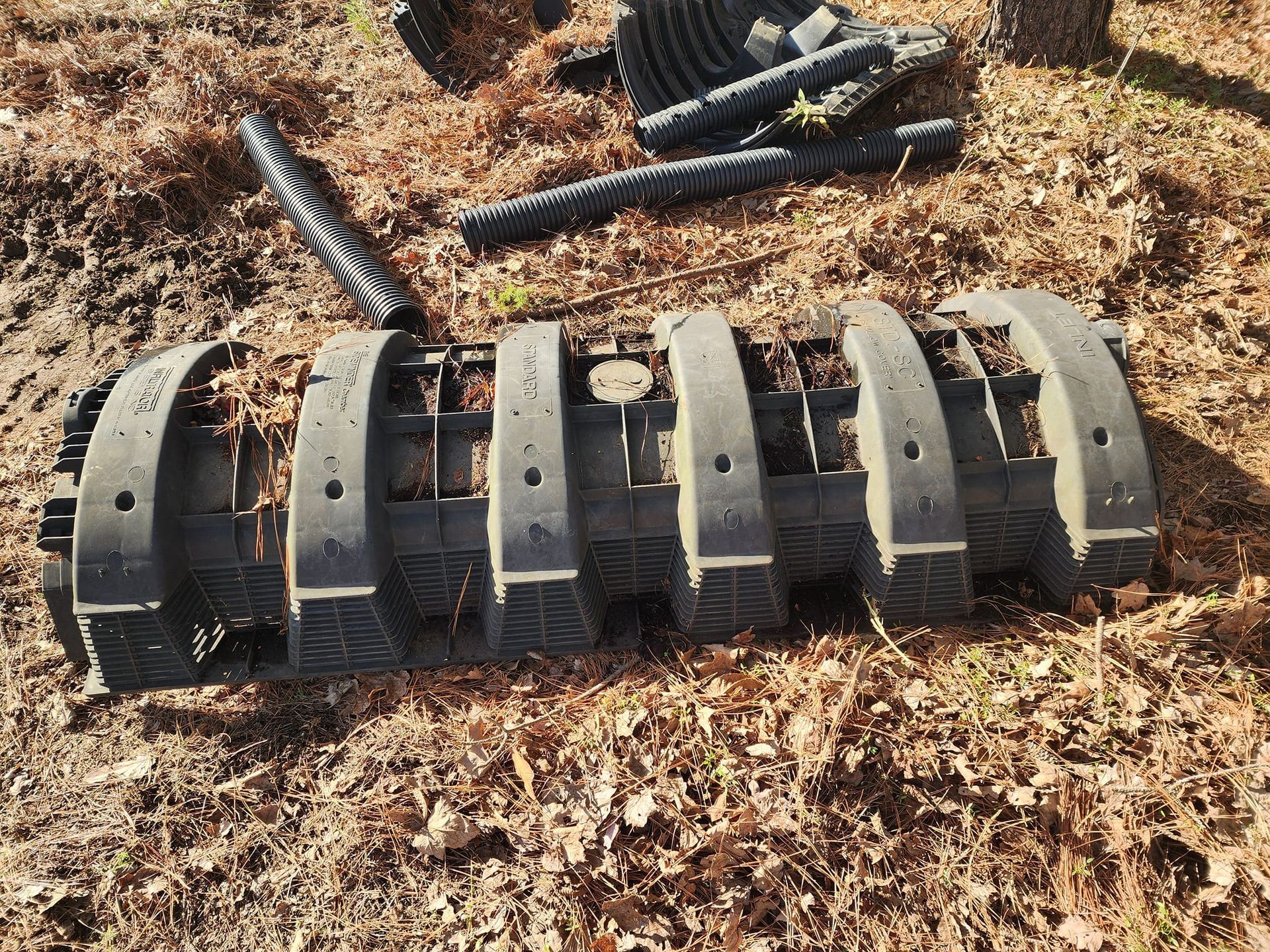 A bunch of pieces of metal are laying on the ground