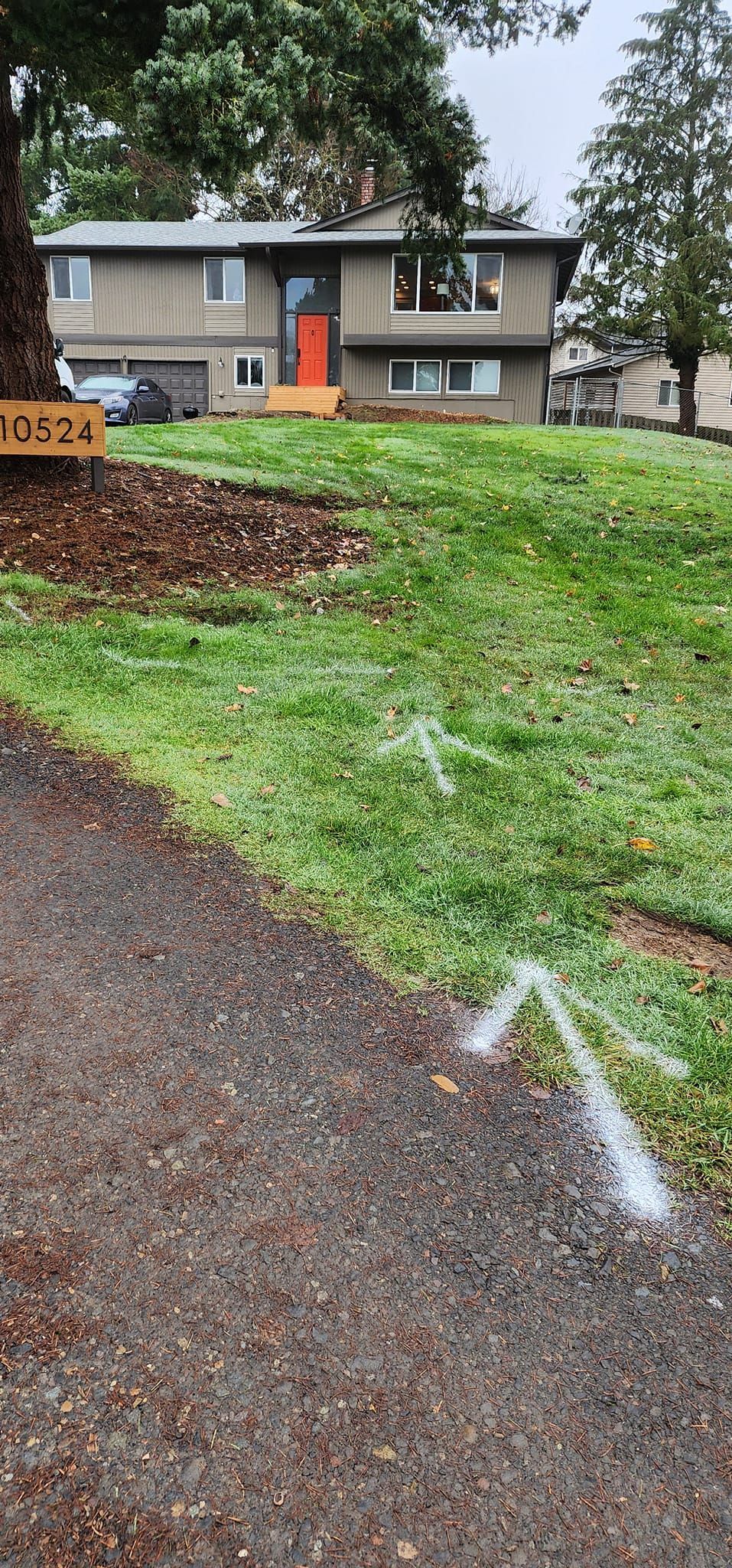 A dirt path leading to a house on a hill.