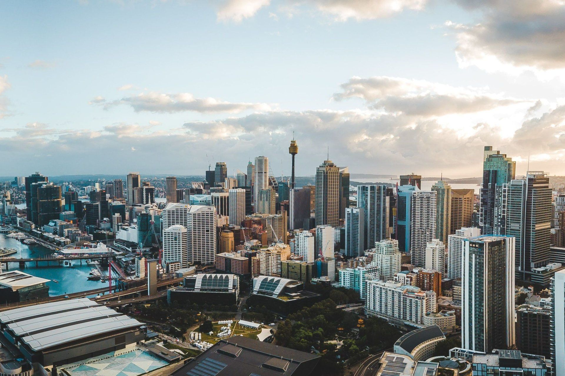 an aerial view of a city with the sydney tower in the foreground