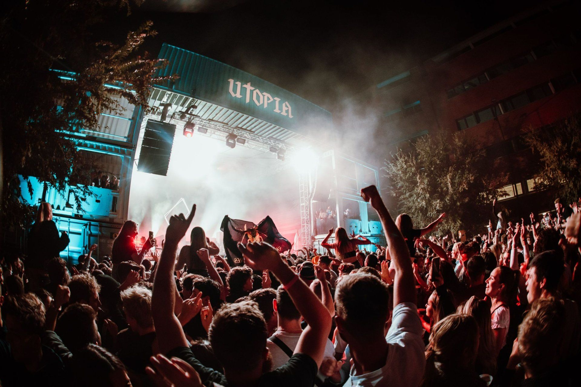 a crowd of people watching a concert at utopia