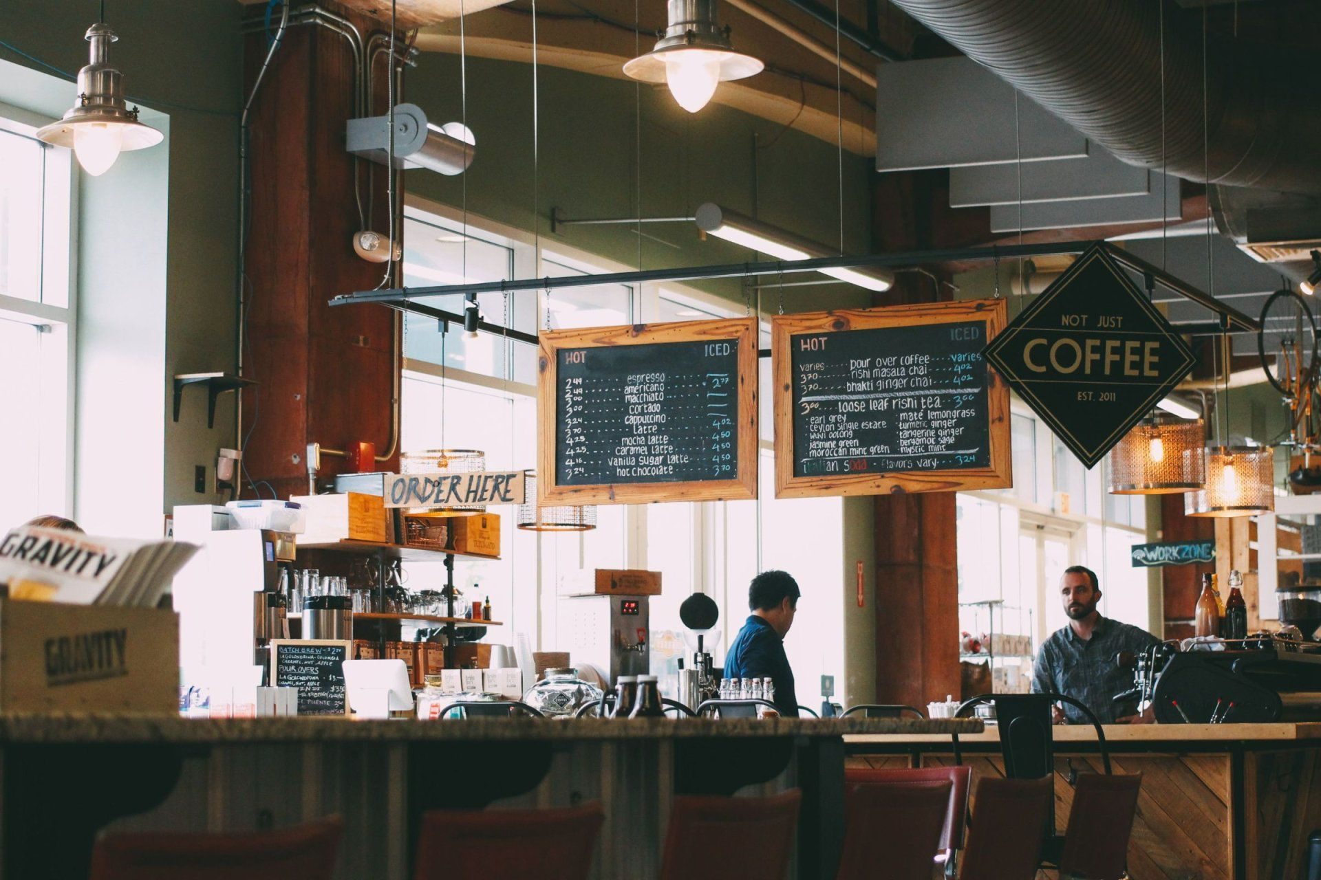 a coffee shop with a sign that says hot just coffee