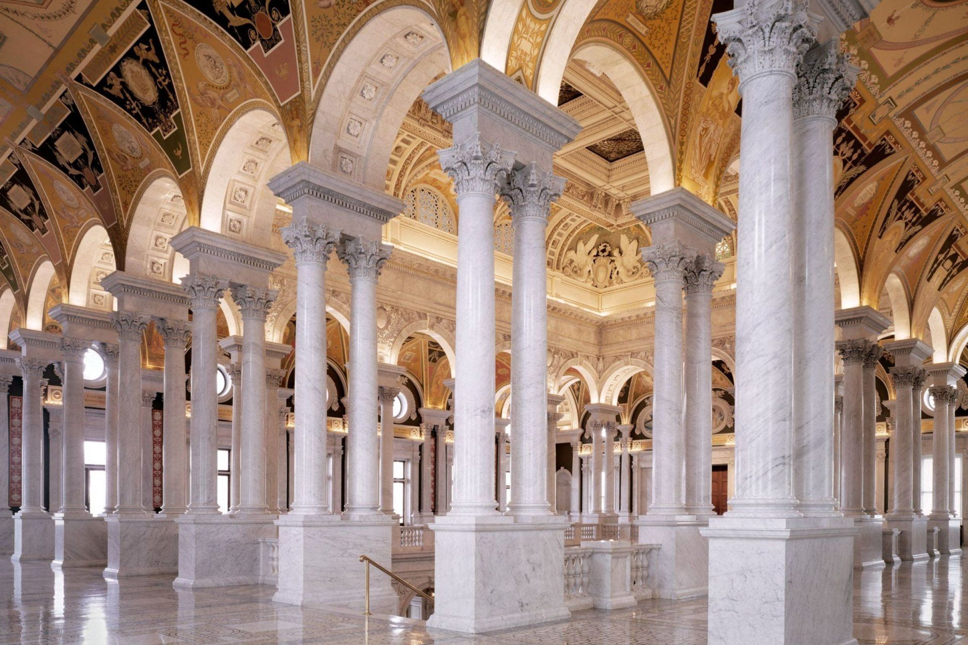 a building with columns and arches has a ceiling that says ' liberty ' on it