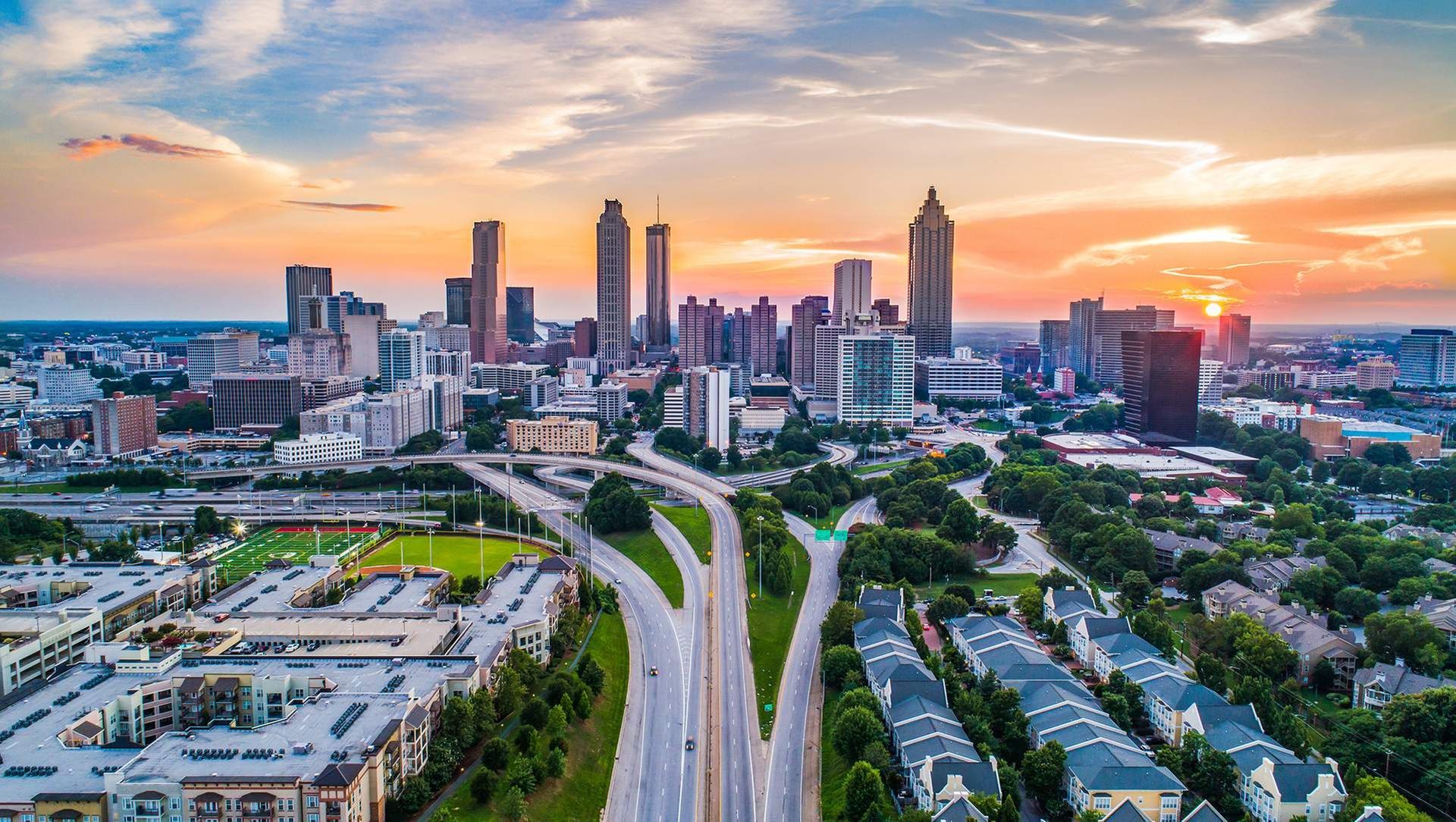 an aerial view of the city of atlanta at sunset