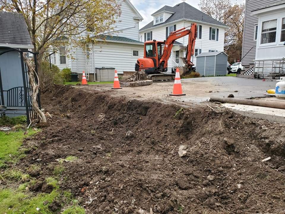 a large pile of dirt is in front of a house