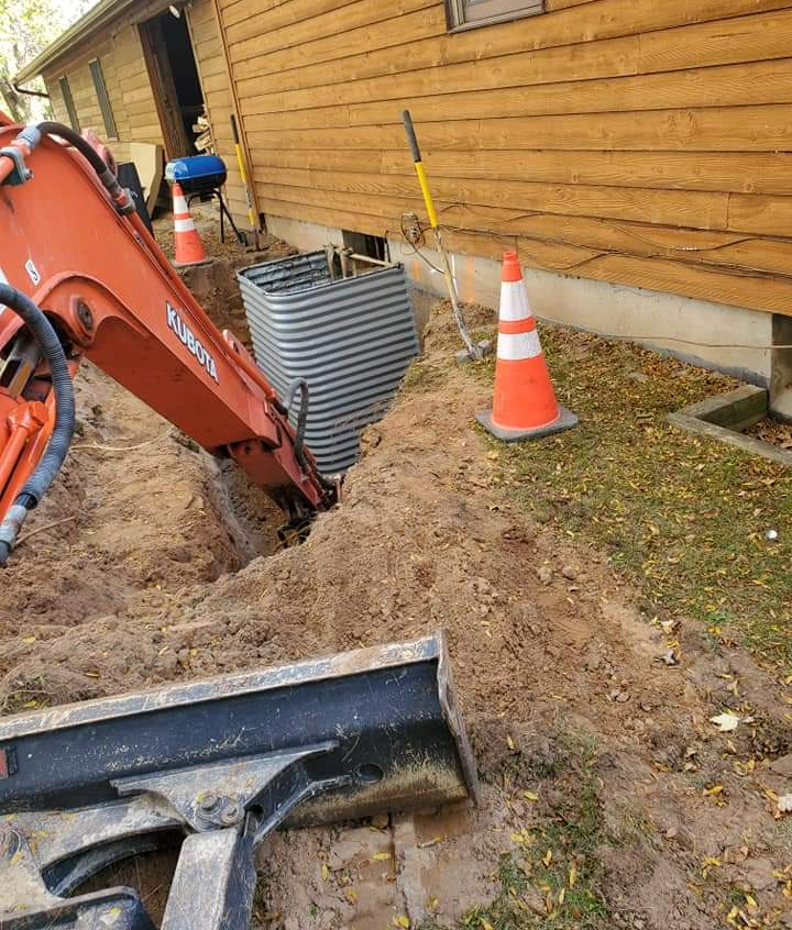 a kubota excavator is digging a hole in the ground