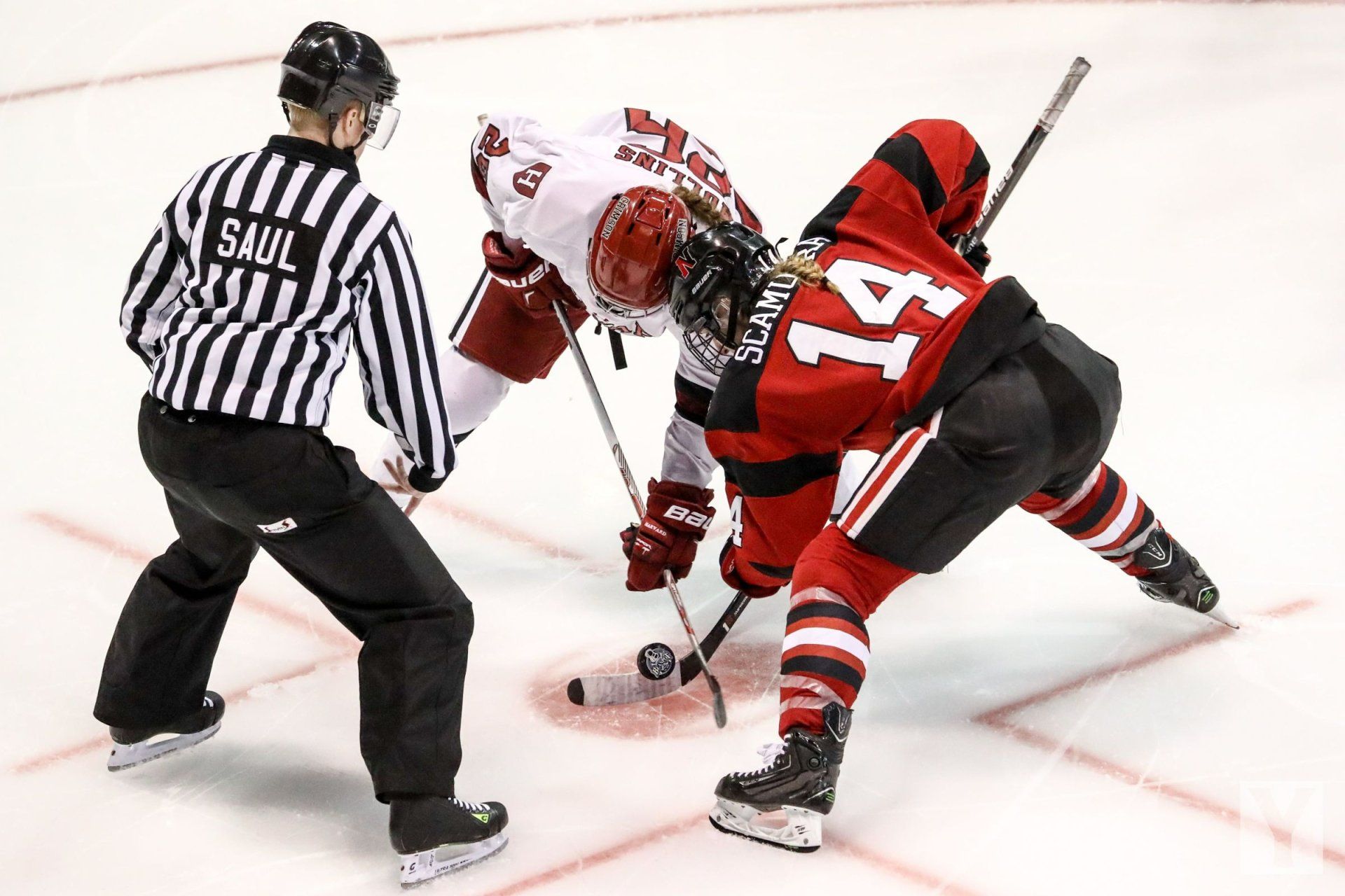 a hockey player with the number 14 on the back of his jersey