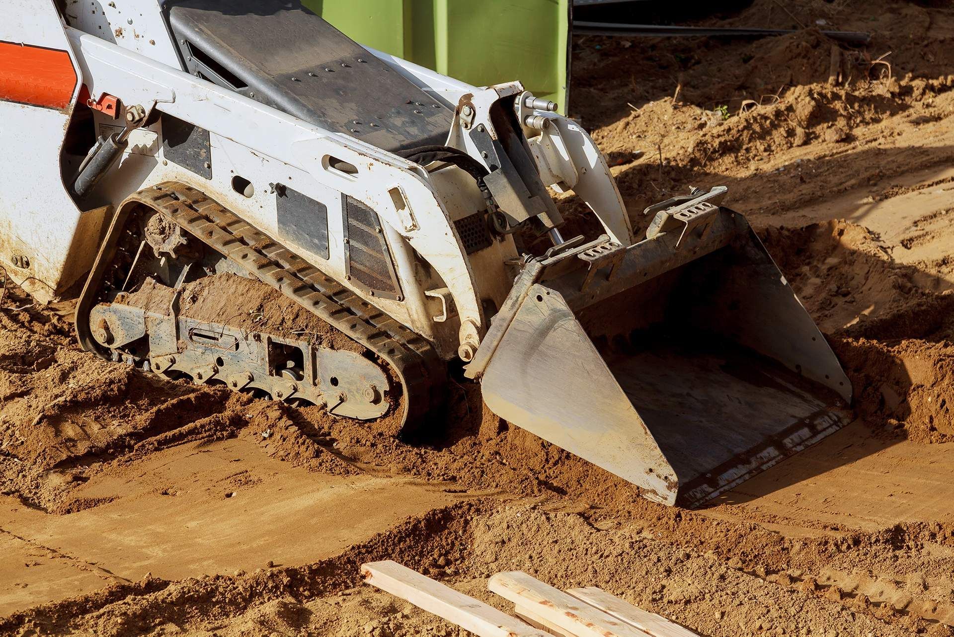 A bulldozer is moving dirt on a construction site