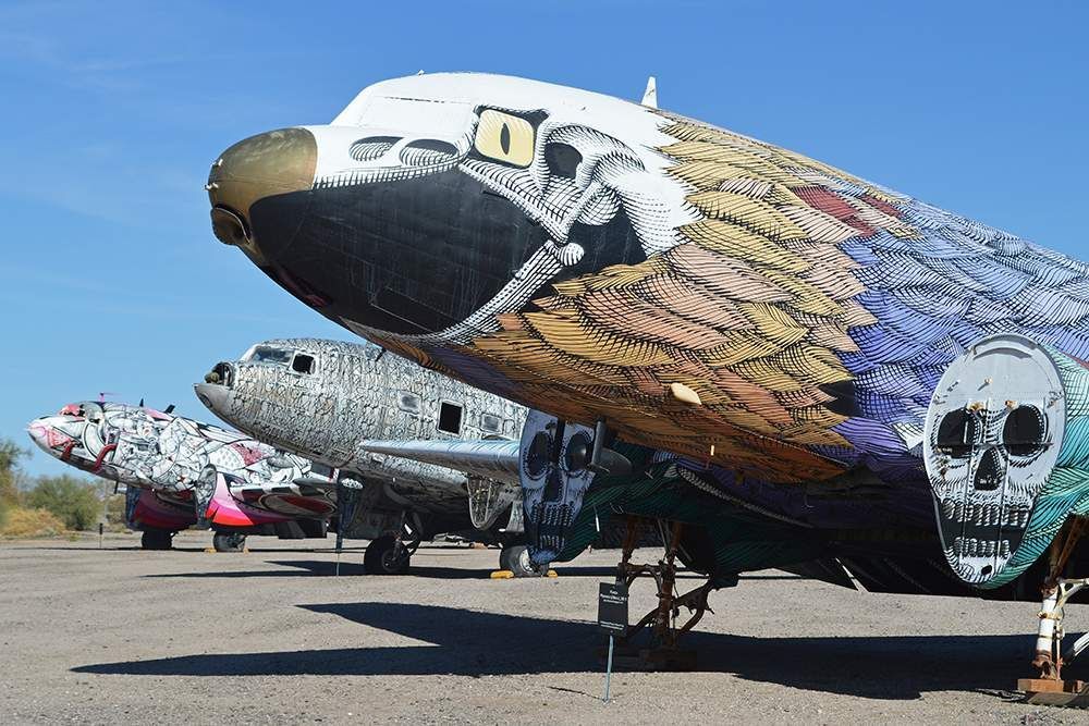 A row of planes with skulls painted on them